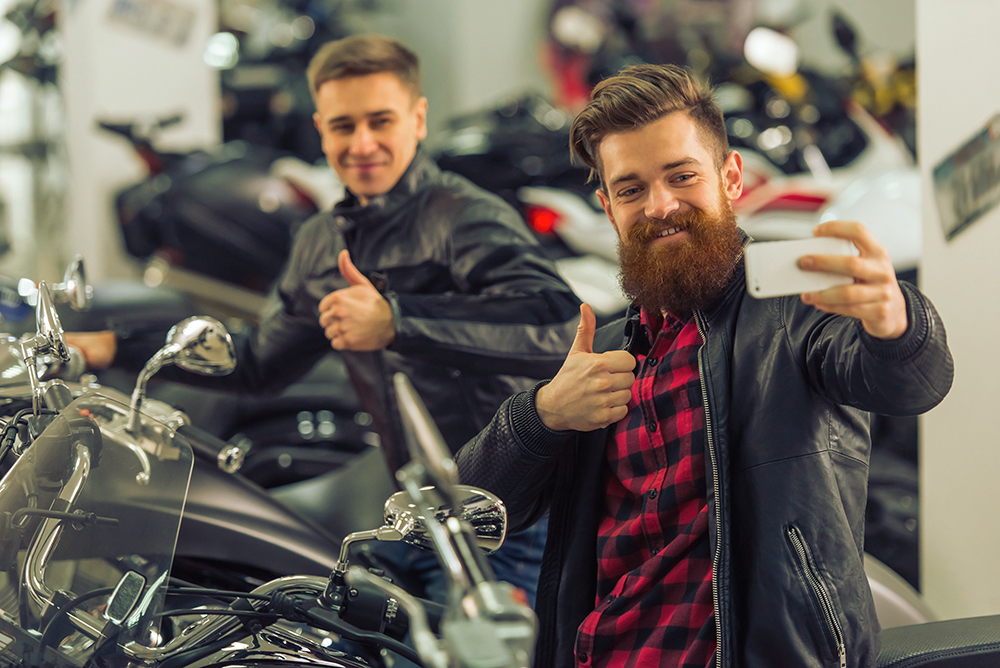 bikers with thumbs up